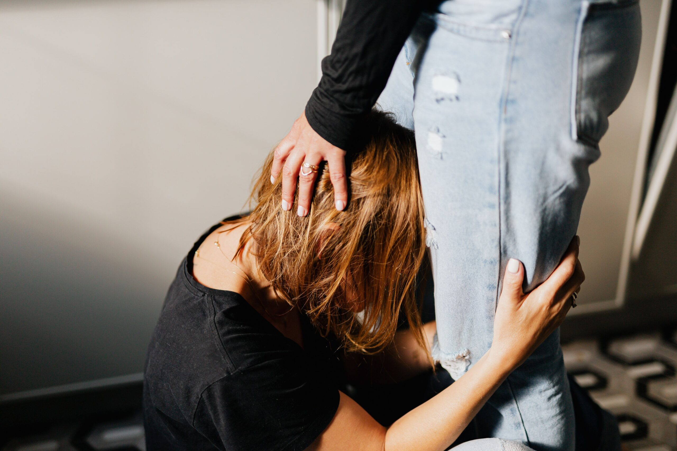 Close-up of an emotional scene between two women conveying sadness and support.